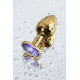 Золотистая коническая анальная пробка с фиолетовым кристаллом - 7 см. (фиолетовый)