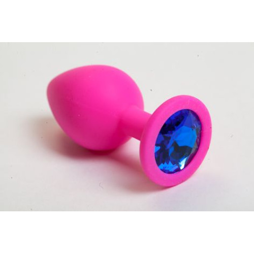 Розовая силиконовая анальная пробка с синим стразом - 8,2 см. (синий)