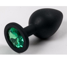 Черная силиконовая анальная пробка с зеленым кристаллом - 9,5 см. (зеленый)
