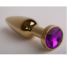 Золотистая анальная пробка с фиолетовым кристаллом - 11,2 см. (фиолетовый)