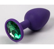 Фиолетовая силиконовая анальная пробка с зеленым стразом - 7,1 см. (зеленый)