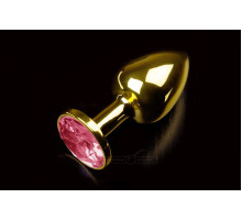 Маленькая золотистая анальная пробка с круглым кончиком и рубиновым кристаллом - 7 см. (красный)