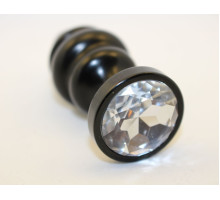 Черная фигурная анальная пробка с прозрачным кристаллом - 8,2 см. (прозрачный)