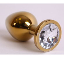 Золотистая анальная пробка с прозрачным кристаллом - 8,2 см. (прозрачный)