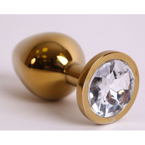 Золотистая анальная пробка с прозрачным кристаллом - 8,2 см. (прозрачный)
