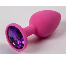 Розовая силиконовая анальная пробка с фиолетовым стразом - 7,1 см. (фиолетовый)