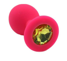 Розовая силиконовая анальная пробка с жёлтым кристаллом - 7 см. (желтый)